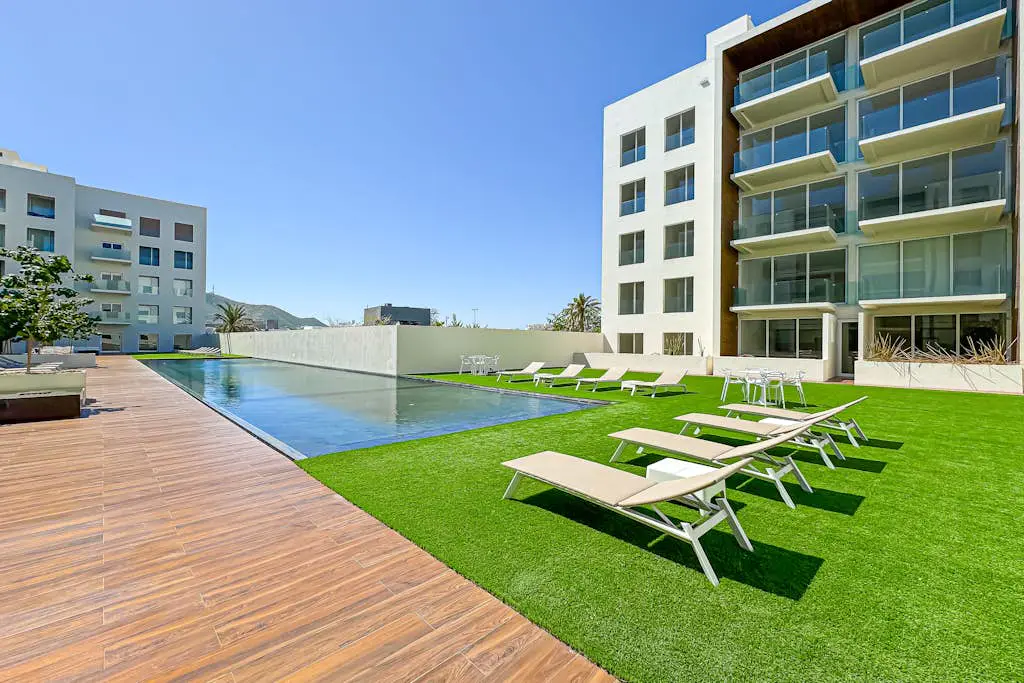 Luxury condo with shared gym, rooftop pool, and centrally located
