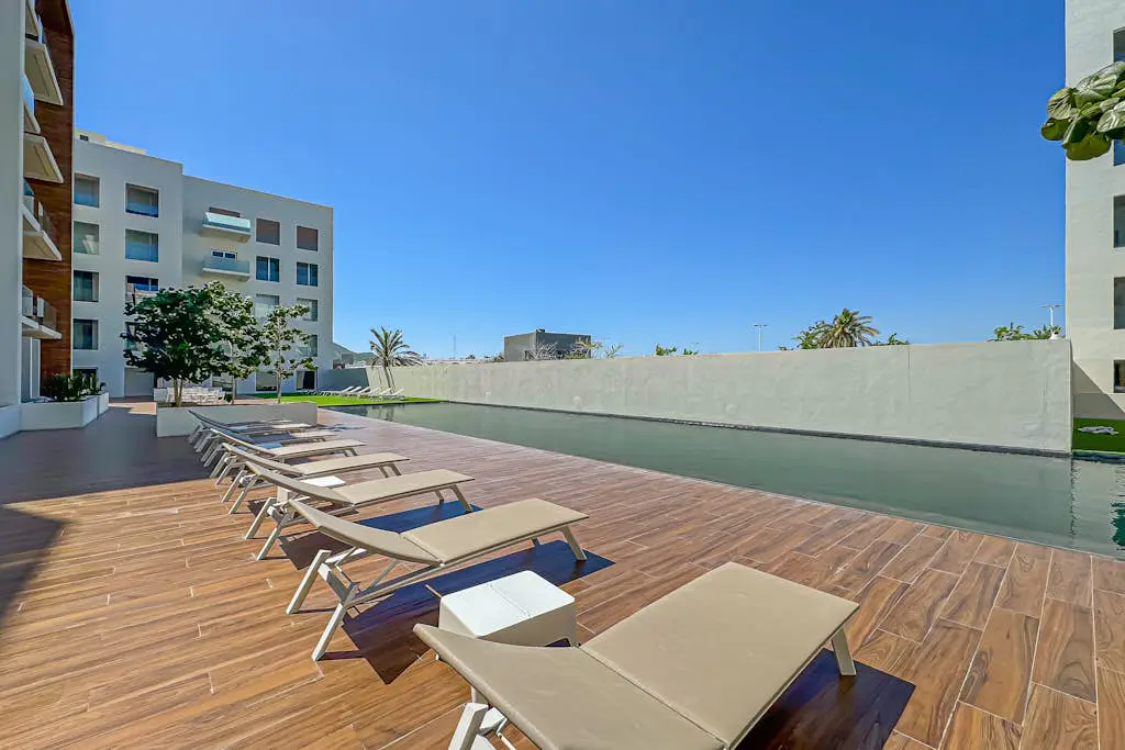 Luxury condo with shared gym, rooftop pool, and centrally located
