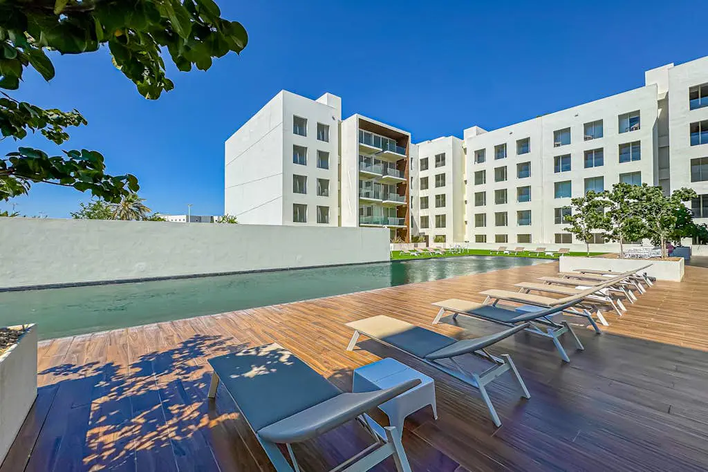 Luxury condo with shared gym, rooftop pool, and centrally located
