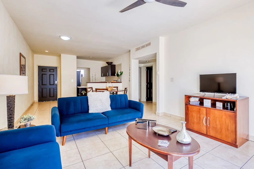 Beautiful condo with a balcony, kitchen, sparkling pools, & fitness center