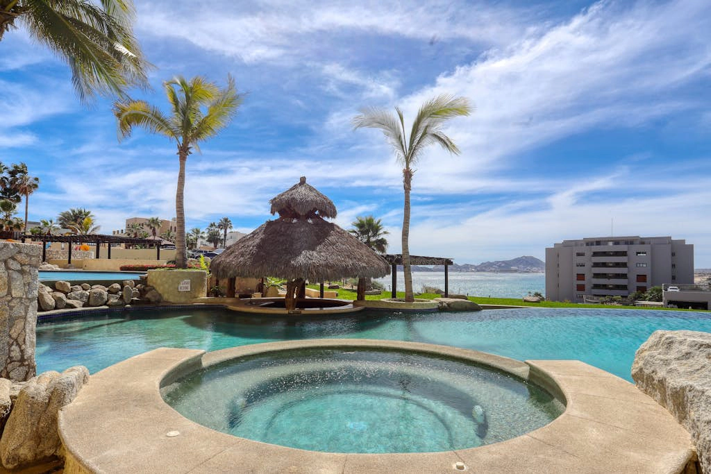 Stylish coastal retreat with breathtaking views, resort pool & private balcony