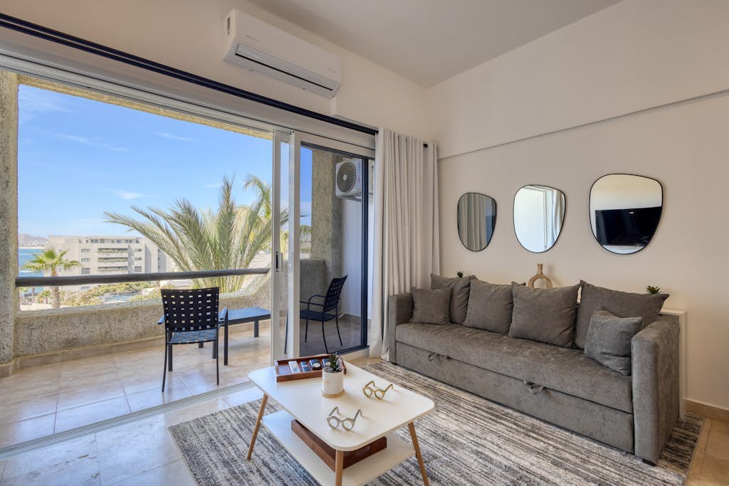 Stylish coastal retreat with breathtaking views, resort pool & private balcony