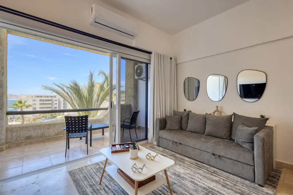 Stylish coastal retreat with breathtaking views, resort pool & private balcony