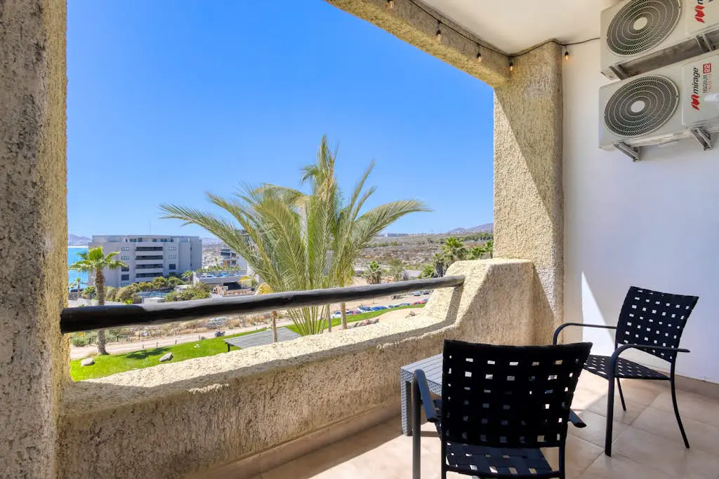 Stylish coastal retreat with breathtaking views, resort pool & private balcony