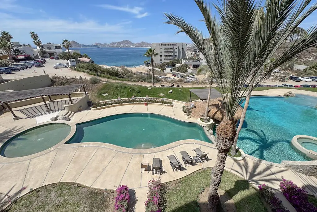 Stylish coastal retreat with breathtaking views, resort pool & private balcony
