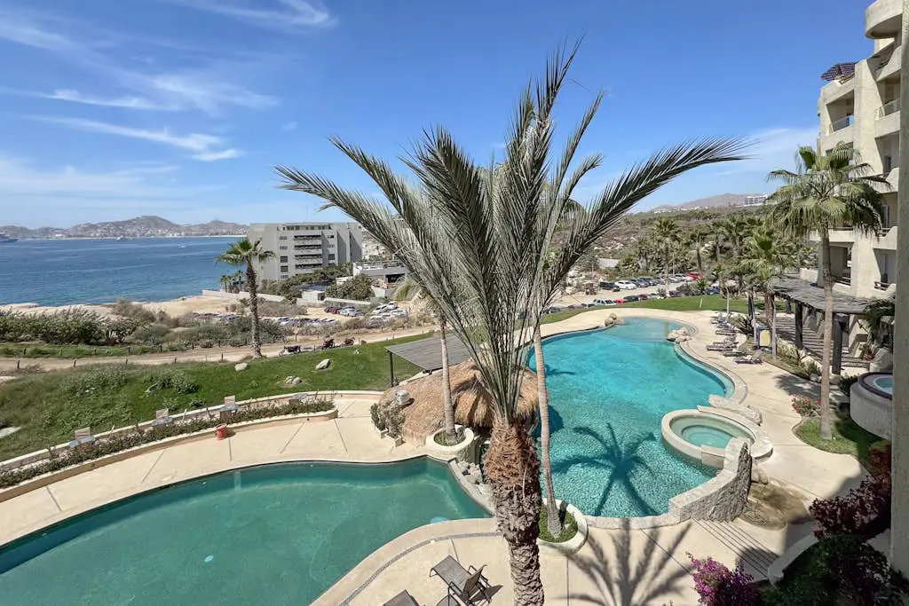 Stylish coastal retreat with breathtaking views, resort pool & private balcony