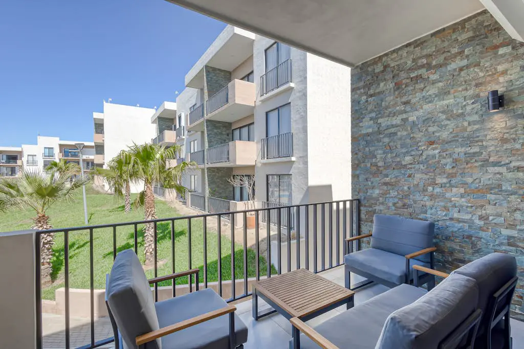 Bright and modern condo w/ balcony, shared pool, a/c, minutes to beach & town