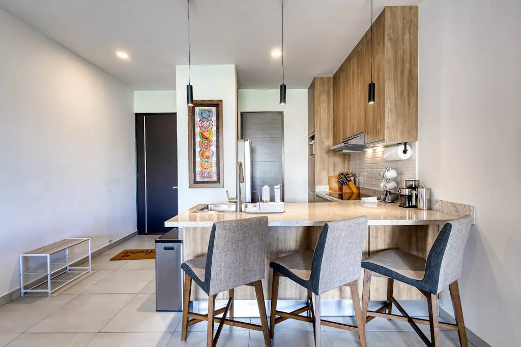 Bright and modern condo w/ balcony, shared pool, a/c, minutes to beach & town