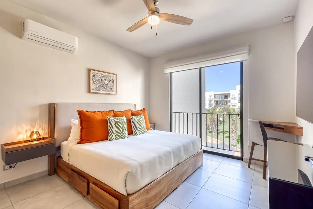 Bright and modern condo w/ balcony, shared pool, a/c, minutes to beach & town