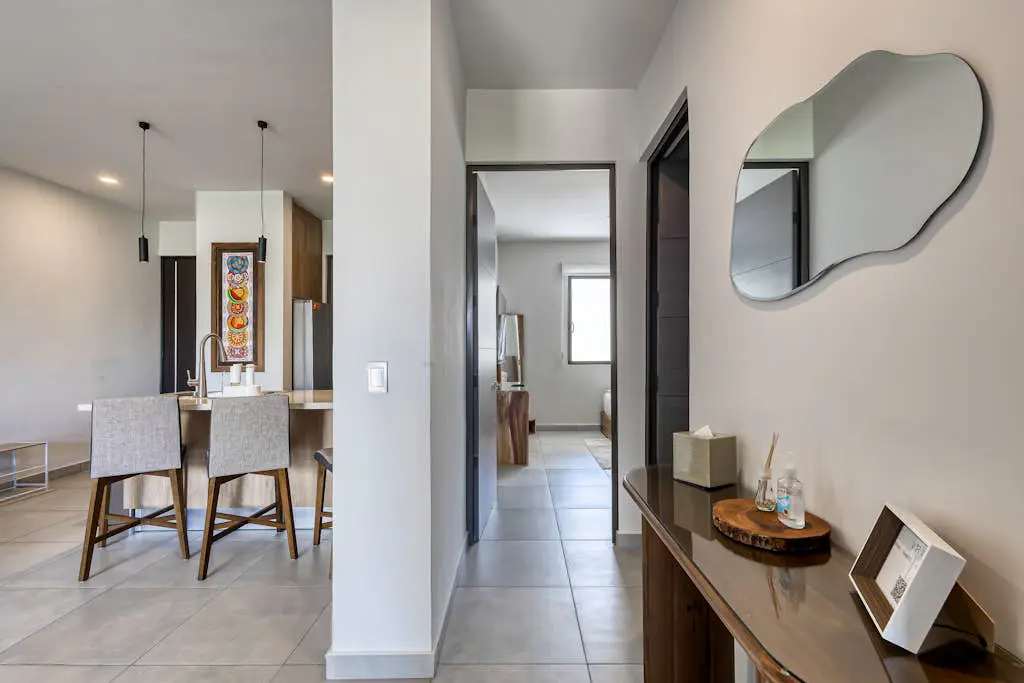 Bright and modern condo w/ balcony, shared pool, a/c, minutes to beach & town