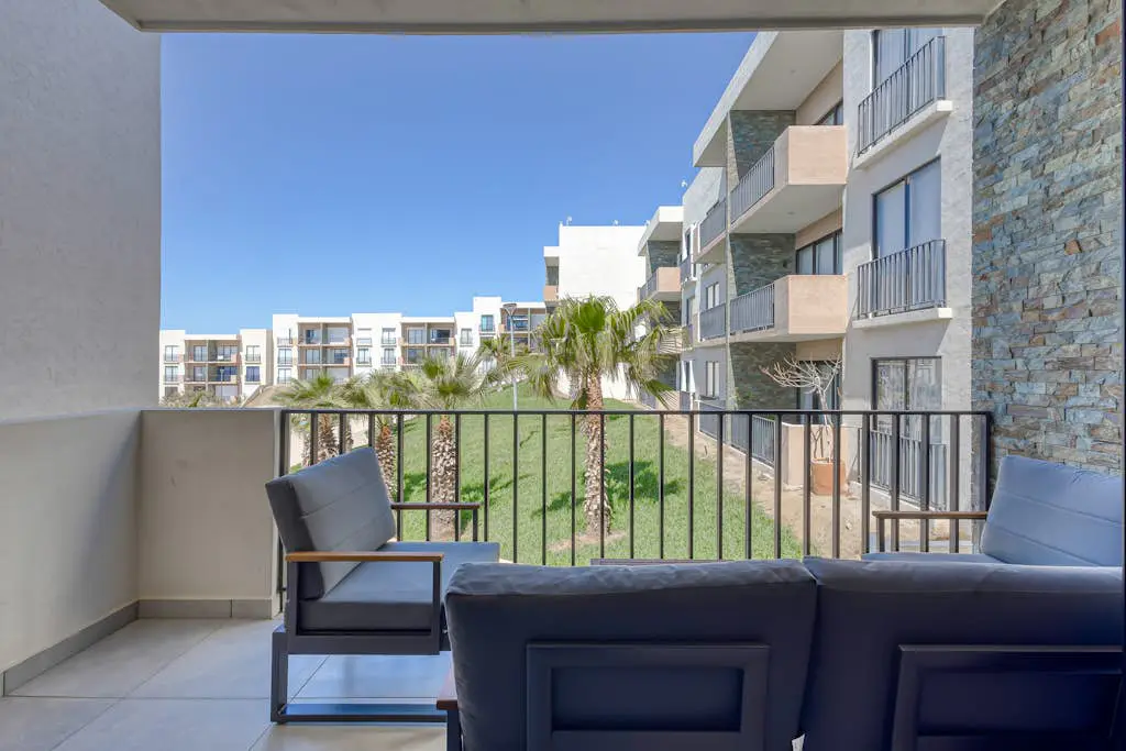 Bright and modern condo w/ balcony, shared pool, a/c, minutes to beach & town