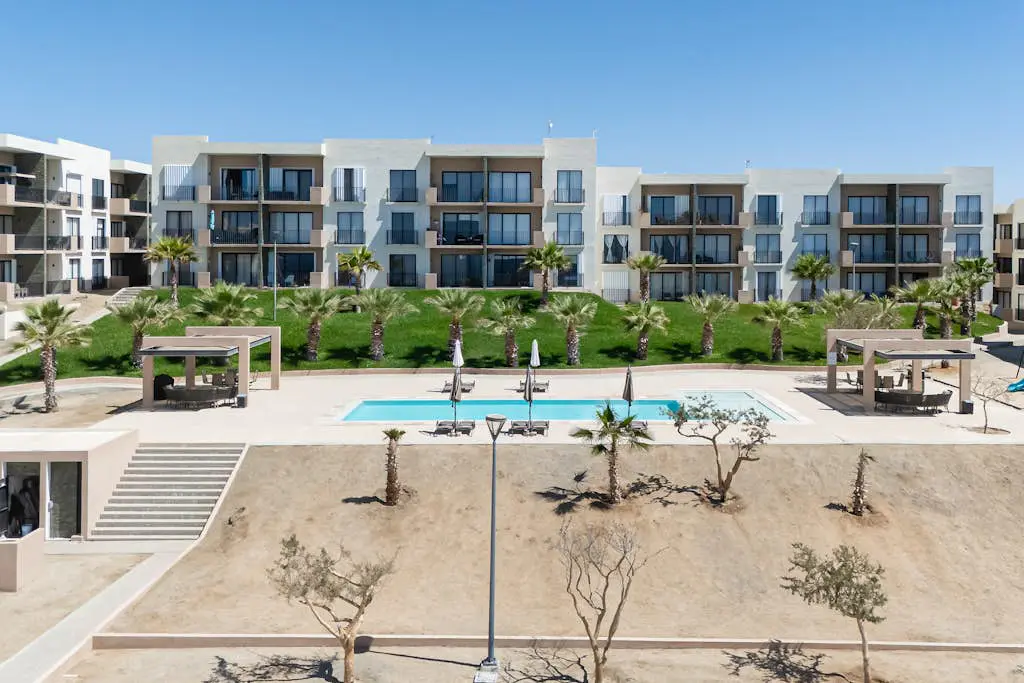 Bright and modern condo w/ balcony, shared pool, a/c, minutes to beach & town
