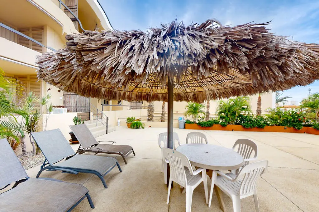 Inviting apartment across from the beach with pool, grill, balcony & golf nearby