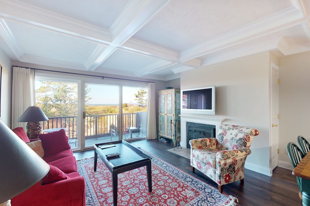 Riverfront condo with beach access to lake, fireplace, furnished deck & cable