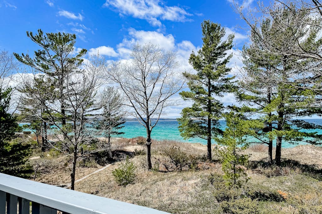 Waterfront condo near skiing with beach access, on-site golf & fireplace