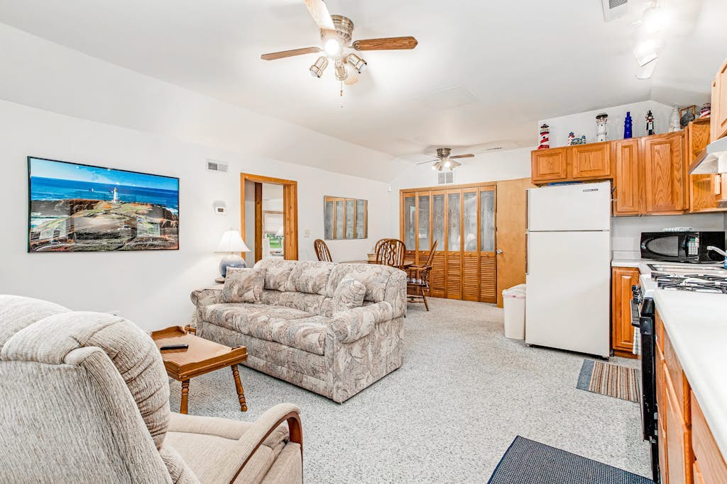 Charming home with sunroom, large yard, full kitchen, & washer/dryer