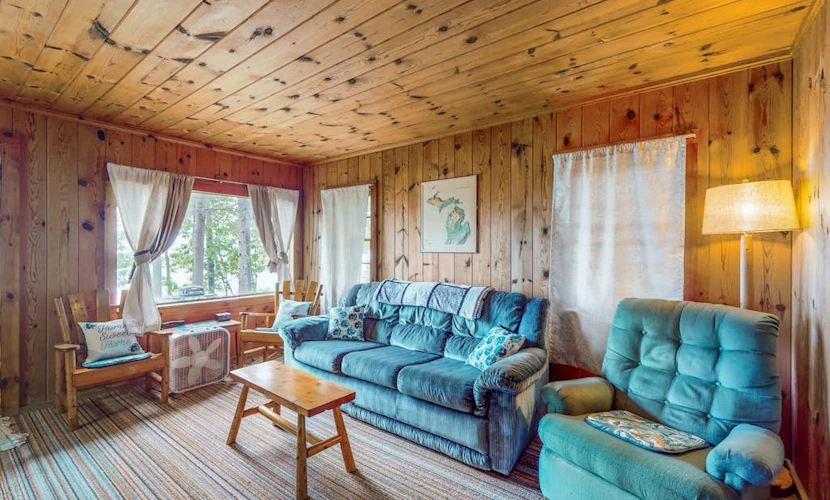 Charming lakefront cottage with large yard, dock, & fire pit - close to downtown