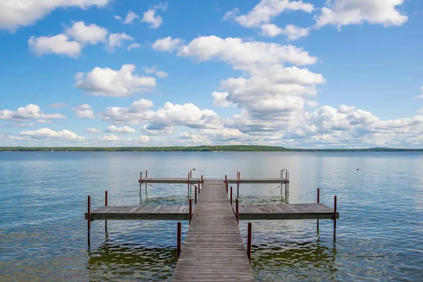 Charming lakefront cottage with large yard, dock, & fire pit - close to downtown
