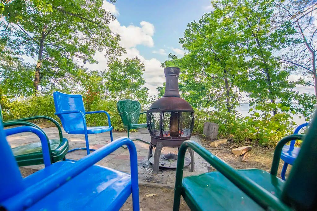 Charming lakefront cottage with large yard, dock, & fire pit - close to downtown