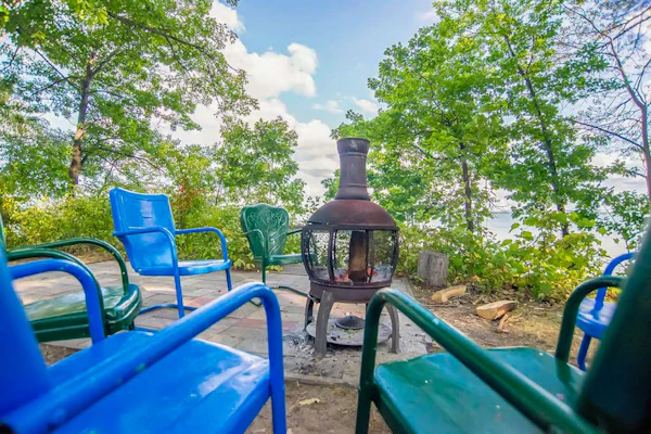 Charming lakefront cottage with large yard, dock, & fire pit - close to downtown