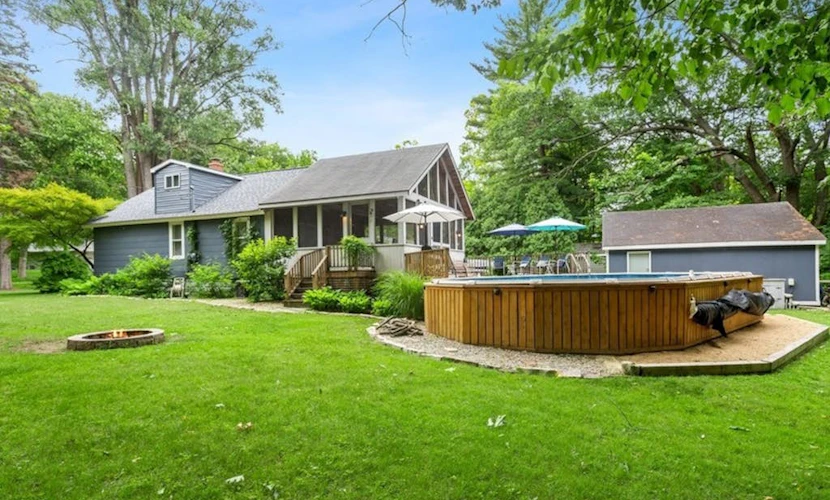 Charming cottage with fast WiFi, fire pit, above-ground pool, & huge sunroom