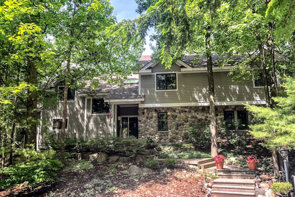 Spacious home with studio, lake access, sunroom, fireplace, W/D, & central AC