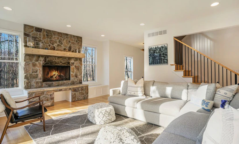Modern Lake Michigan home with wood fireplace, open layout, deck, W/D, & AC