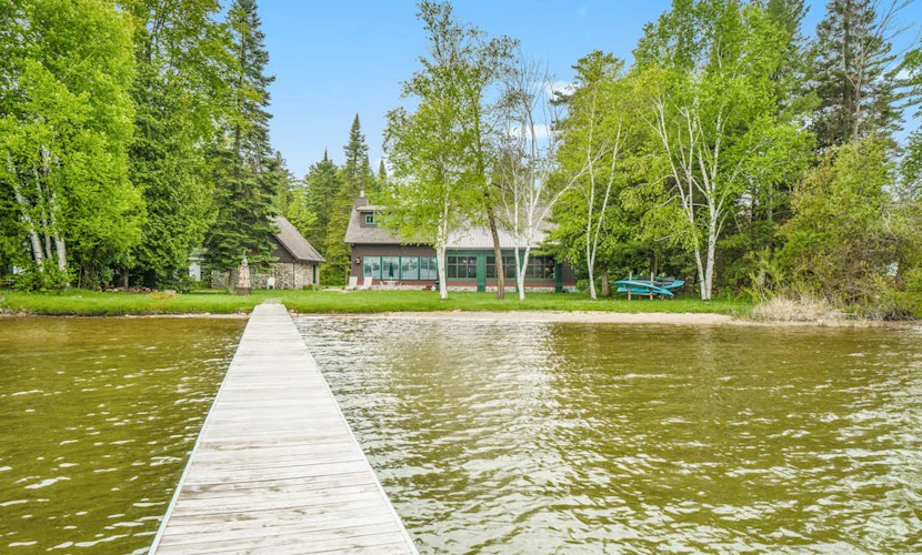 Lakefront home with Platte Lake views - private dock, kayaks & paddleboards