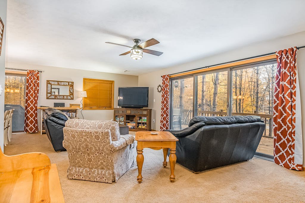 Stunning two-story home in the trees w/ a firepit, furnished deck, & balcony