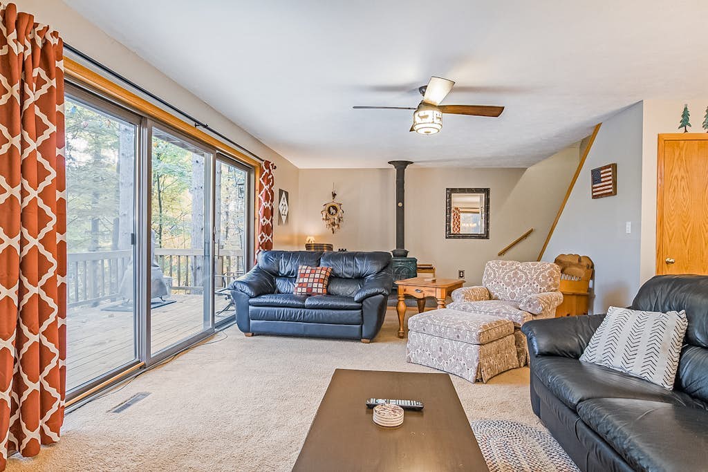 Stunning two-story home in the trees w/ a firepit, furnished deck, & balcony