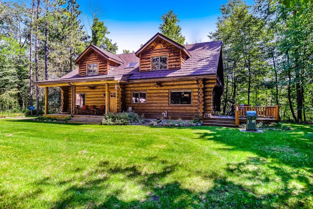 Waterfront home on Betsie River with hot tub & sauna near skiing at Crystal Mtn