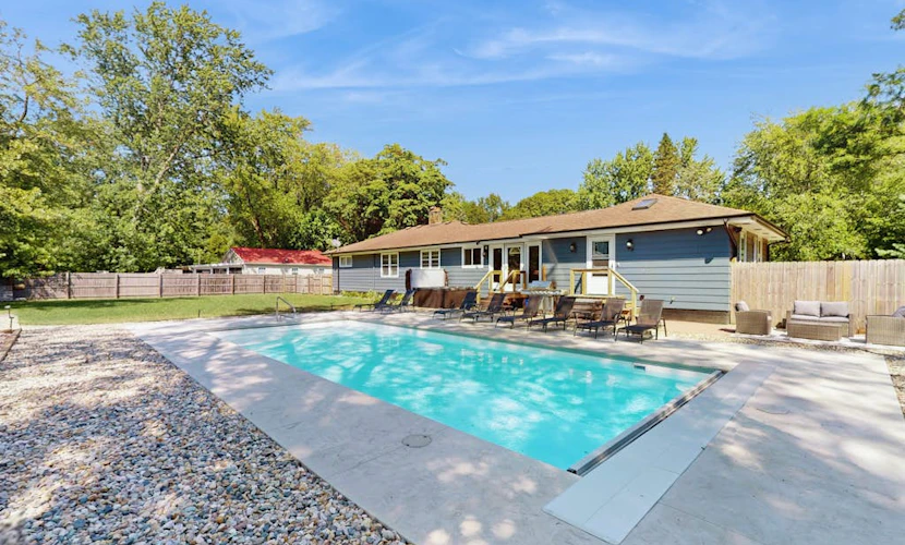 Lovely home with hot tub, pool, two kitchens, enclosed backyard, firepit & grill