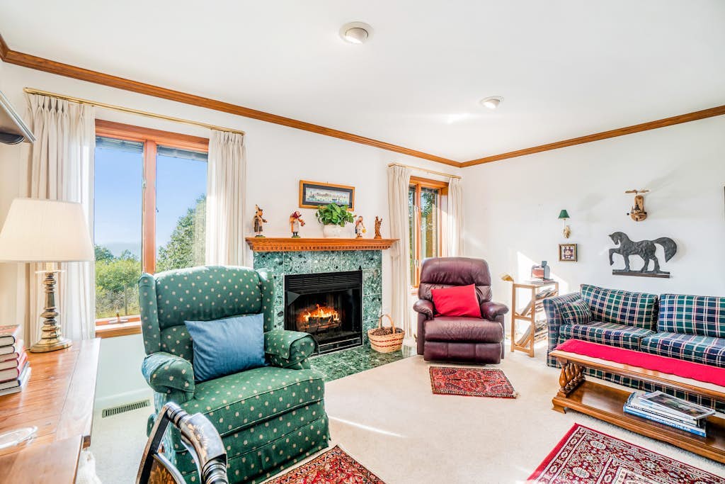 Dog-friendly, lake view home with three season room, fireplace, video projector