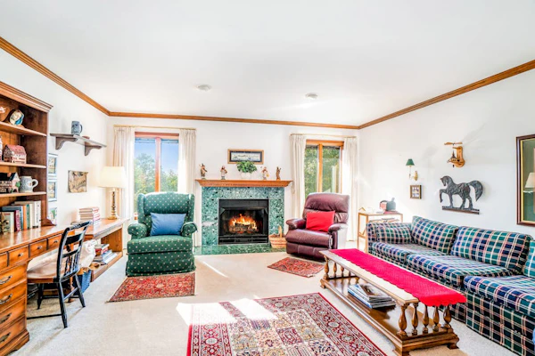 Dog-friendly, lake view home with three season room, fireplace, video projector