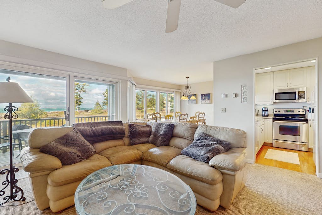 Beachfront condo on Lake Michigan with fireplace, deck, washer/dryer, great view