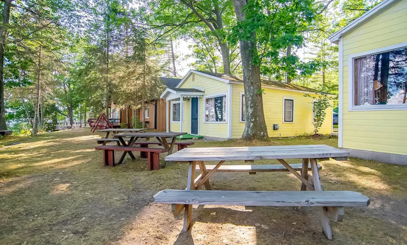 Charming lakefront cottage with large yard, dock, & fire pit - close to downtown