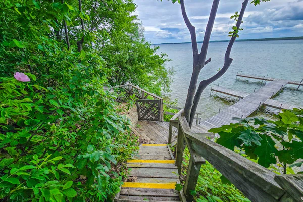 Charming lakefront cottage with large yard, dock, & fire pit - close to downtown