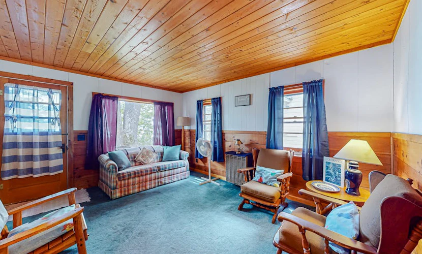 Charming lakefront cottage with large yard, dock, & fire pit - close to downtown