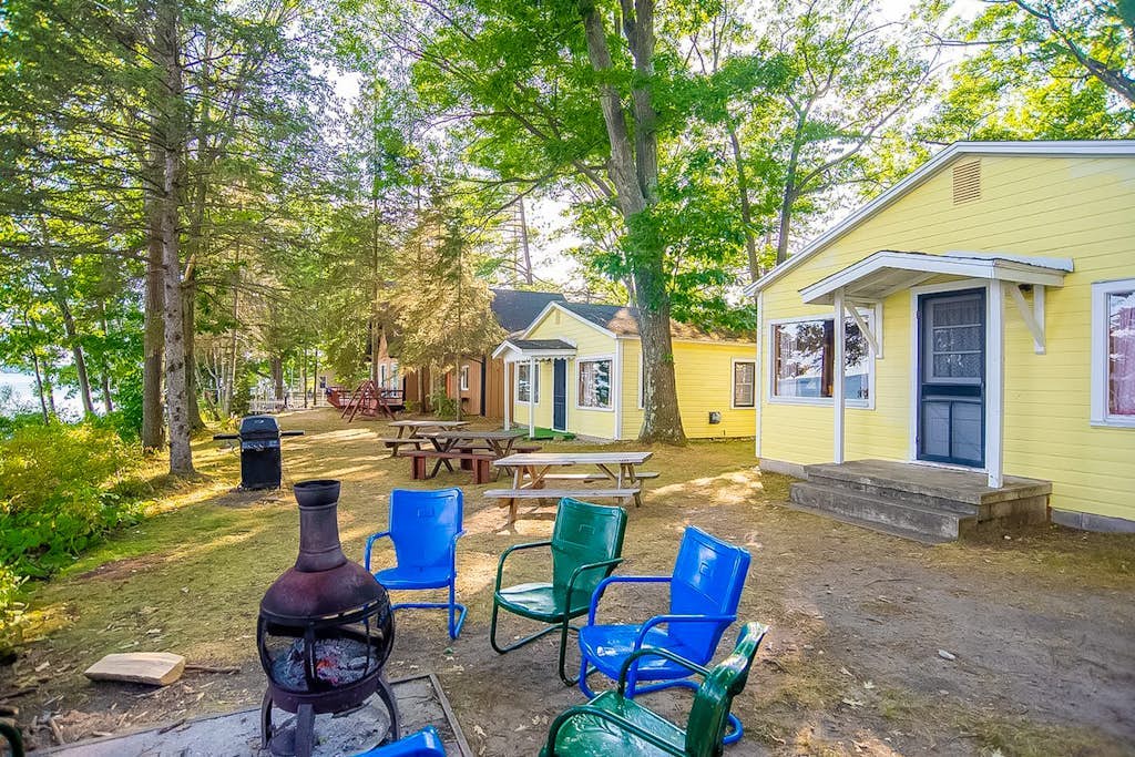 Charming lakefront cottage with large yard, dock, & fire pit - close to downtown
