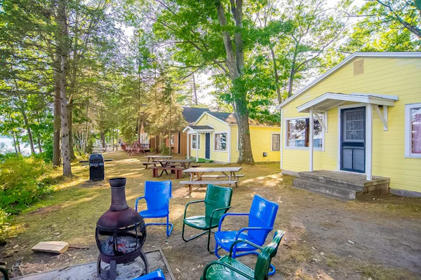 Charming lakefront cottage with large yard, dock, & fire pit - close to downtown