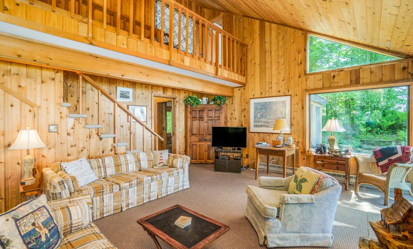 Rustic dream-home w/ lake views, wraparound deck, & wood-burning fireplace