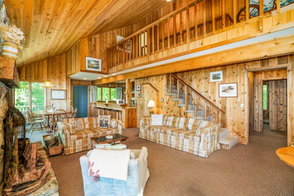 Rustic dream-home w/ lake views, wraparound deck, & wood-burning fireplace