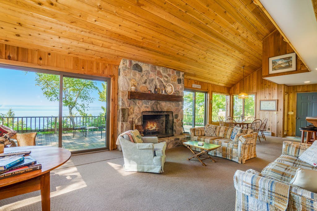 Rustic dream-home w/ lake views, wraparound deck, & wood-burning fireplace