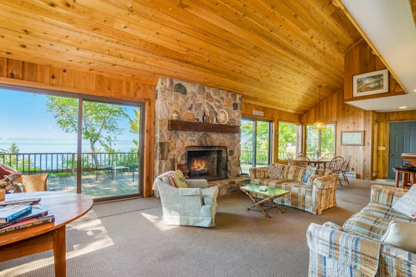 Rustic dream-home w/ lake views, wraparound deck, & wood-burning fireplace