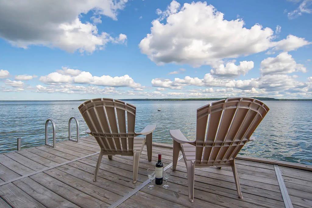 Incredible lakefront retreat with dock, fire pit, decks, yard, & amazing views
