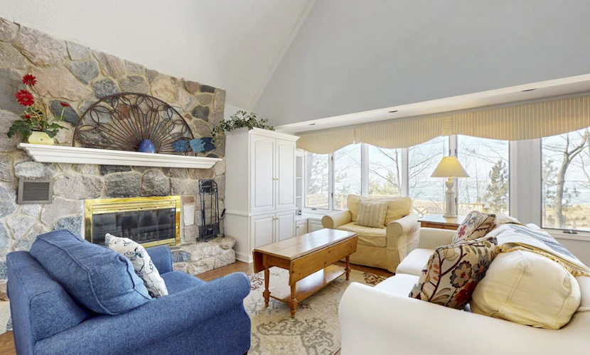 Spacious lakefront home with panoramic views and private beach