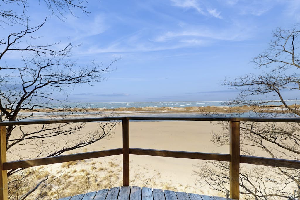 Spacious lakefront home with panoramic views and private beach