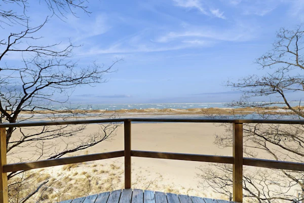 Spacious lakefront home with panoramic views and private beach