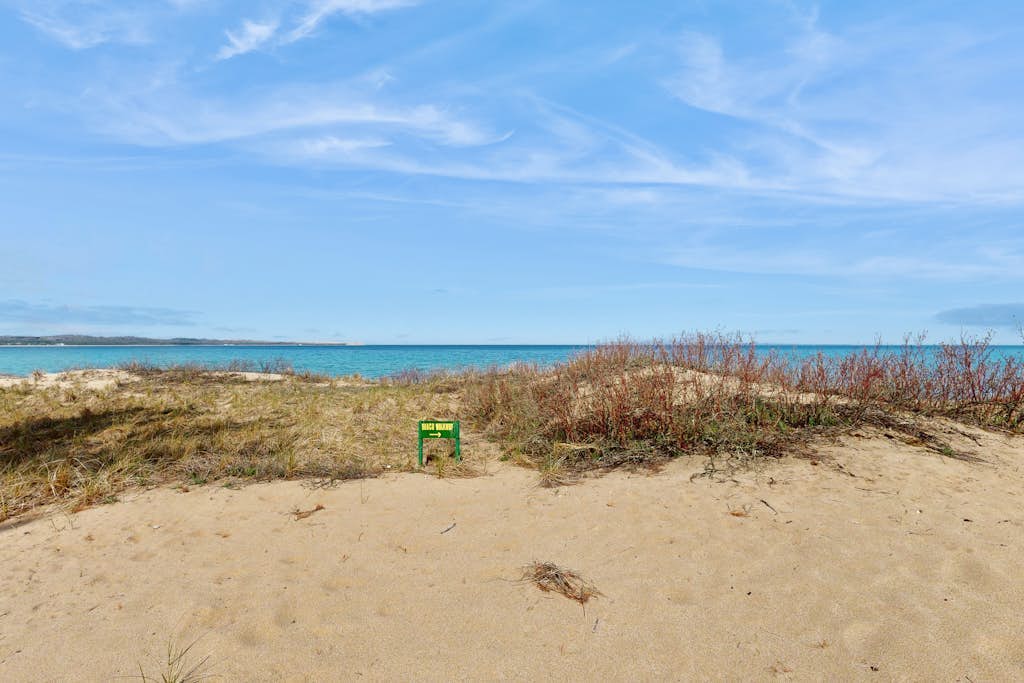 Desirable beachfront condo in Glen Arbor with patio, fireplace, kitchenette & AC