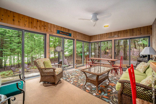 Two-story home with a patio, sunroom, balcony, & washer/dryer access